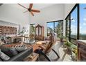 Sun-filled living room with vaulted ceilings, mountain views, and stylish furnishings at 8453 S Scenic Dr, Morrison, CO 80465