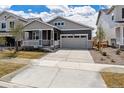 Charming single Gathering home featuring a cozy front porch and a two-car attached garage at 24788 E 40Th Ave, Aurora, CO 80019