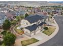 Stunning aerial view of a two-story home with a three-car garage in a scenic neighborhood at 2463 Tavern Way, Castle Rock, CO 80104