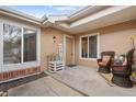 Inviting front porch with cozy seating, plants, and a friendly sign, perfect for relaxing outdoors at 8112 Gray Ct # 394, Arvada, CO 80003