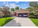 Lovely home with a spacious driveway leading to a two-car garage, ideal for car enthusiasts at 1026 Deer Clover Way, Castle Pines, CO 80108
