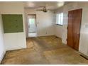Living room featuring neutral walls and original floors, bathed in natural light at 3531 Forest St, Denver, CO 80207