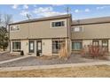 Well-maintained townhome with classic design, landscape rock, and updated architectural elements at 4641 W Ponds Cir, Littleton, CO 80123