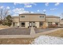 Inviting townhome with a well-kept exterior, stone landscaping, and attractive design at 4641 W Ponds Cir, Littleton, CO 80123