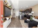 Inviting open-concept living space featuring hardwood floors and modern decor at 1380 S Boston Ct # A, Denver, CO 80247