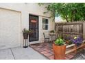 Charming front porch with brick pavers and potted plants at 1532 N High St # 1, Denver, CO 80218