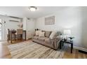 Inviting living room with a comfortable couch, stylish decor, and hardwood floors at 1532 N High St # 1, Denver, CO 80218