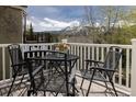 Outdoor seating area with stunning mountain views from private balcony at 218 Highland Ter, Breckenridge, CO 80424