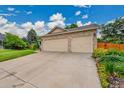 Spacious three-car garage with brick accents and a wide driveway, offering ample parking at 13112 Summit Grove Pkwy, Thornton, CO 80241