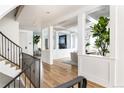 Spacious foyer with hardwood floors and stairs leading to the upper level at 2646 S Madison St, Denver, CO 80210