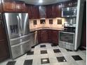 Modern kitchen showcasing stainless steel appliances and dark wood cabinetry at 8822 E Florida Ave # G07, Denver, CO 80247