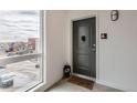 Apartment front door area with decorations and welcome mat in a modern unit at 8475 E 36Th Ave # 337, Denver, CO 80238