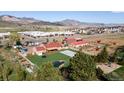 Stunning equestrian property boasts a turf backyard, pond, and ample outbuildings at 5400 S Alkire St, Littleton, CO 80127