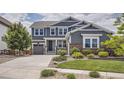 Charming two-story home with well-manicured lawn and landscaping at 9527 Iron Mountain Way, Arvada, CO 80007