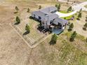Areal view of a lovely home on a large lot with partially fenced yard at 2937 Hidden Den Ct, Franktown, CO 80116