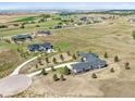 Aerial view of a stunning home on a large lot in a rural neighborhood at 2937 Hidden Den Ct, Franktown, CO 80116