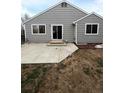The backyard features a concrete patio with sliding glass door access from the house at 2242 S Uravan St, Aurora, CO 80013