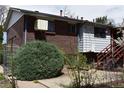 This backyard features a brick exterior and well-manicured landscaping at 14702 E Security Way, Aurora, CO 80011