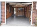 Spacious two-car garage featuring epoxy flooring and interior shelving, perfect for storage and organization at 14702 E Security Way, Aurora, CO 80011