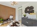 Stylish entryway with wood accent wall and decorative elements creating a welcoming ambiance at 4055 S Niagara Way, Denver, CO 80237