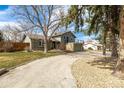 Charming two-story home with a two car garage, brick accents, neutral paint, and upper deck at 8025 S Cody St, Littleton, CO 80128
