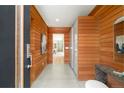 Inviting entryway featuring sleek wood paneling, modern lighting, and minimalist decor at 1452 S Washington St, Denver, CO 80210