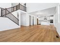 Bright living room with hardwood floors, high ceilings, and a fireplace at 9324 Quartz St, Arvada, CO 80007