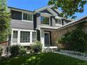 Inviting two-story home with mature landscaping, showcasing the charming front entry at 16341 Maple Rock Ct, Parker, CO 80134