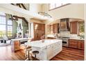 Open concept kitchen with a large island, stainless steel appliances, and custom cabinetry at 5101 Saint Vrain Rd, Longmont, CO 80503
