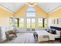 Spacious main bedroom with vaulted ceiling, large windows, and scenic views of the outside at 5101 Saint Vrain Rd, Longmont, CO 80503