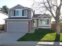 Charming home featuring a well-manicured lawn, inviting entrance, and an attached two car garage at 292 S Pembrook St, Castle Rock, CO 80104