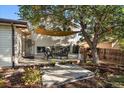 Spacious back deck is shaded with a large sun shade perfect for entertaining at 5060 W 71St Pl, Westminster, CO 80030