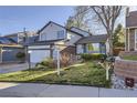 Charming two-story home with landscaped front yard and inviting curb appeal at 11892 Vallejo St, Denver, CO 80234