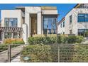 Well-maintained two-story house featuring a blend of stone and wood textures at 427 Milwaukee St, Denver, CO 80206
