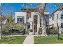 Stylish two-story home with a well-manicured lawn and modern design elements at 427 Milwaukee St, Denver, CO 80206