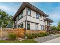 Beautiful two-story home with modern siding, stone accents, and professionally landscaped yard at 5420 Baseline Rd, Boulder, CO 80303