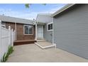 Beautiful home exterior with a covered entry way and patio at 23 Shetland Ct, Highlands Ranch, CO 80130