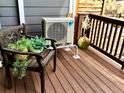 Outdoor balcony features a Daikin AC unit, a wood bench, and views of the surrounding area at 1614 Secrest St, Golden, CO 80401