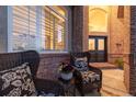 Cozy covered porch with comfortable seating perfect for enjoying outdoor moments at 5364 Dunraven Cir, Golden, CO 80403