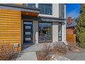 Close up of entrance, modern brickwork, architectural details, landscaping, and a secure front door at 3135 W 25Th Ave, Denver, CO 80211