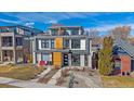 Modern home with multiple balconies, neutral-toned brick, professional landscaping, and contemporary design elements at 3135 W 25Th Ave, Denver, CO 80211
