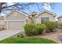 Attractive single-Gathering home featuring stone accents and mature landscaping at 22312 E Plymouth Cir, Aurora, CO 80016