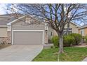 Charming single-Gathering home with a two-car garage and landscaped front yard at 22312 E Plymouth Cir, Aurora, CO 80016