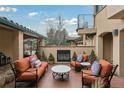 Inviting outdoor patio featuring a fireplace, comfortable seating, and stylish decor at 7088 Indian Peaks Trl, Boulder, CO 80301