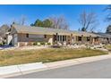 Single-story home featuring a well-manicured front yard, a welcoming entrance, and an attached garage at 6902 S Jackson Way, Centennial, CO 80122