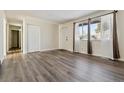 Spacious living room with ample natural light and a large closet for storage at 14830 Robins Dr, Denver, CO 80239