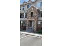 Inviting condo entrance showcasing stone accents and well-manicured greenery at 12711 Colorado Blvd # 1116, Thornton, CO 80241