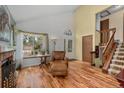 Bright living room featuring hardwood floors, fireplace, and lots of natural light at 13341 Birch Cir, Thornton, CO 80241