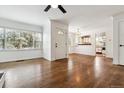 Bright living room features hardwood floors, large windows and a door leading to the exterior at 2731 S Pearl St, Englewood, CO 80113