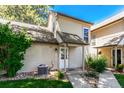 Charming home exterior with a beige facade, landscaped yard, and inviting front entrance at 2101 S Victor St # C, Aurora, CO 80014